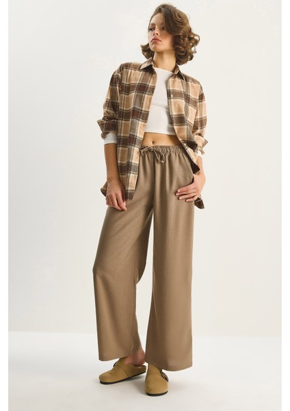 Kadın Yüksek Bel Beli Lastikli Bağlama Detaylı Cepli Kumaş Bol Pantolon