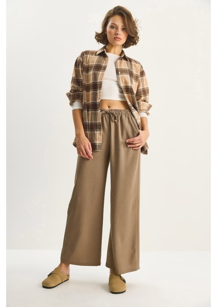 Kadın Yüksek Bel Beli Lastikli Bağlama Detaylı Cepli Kumaş Bol Pantolon modelleri