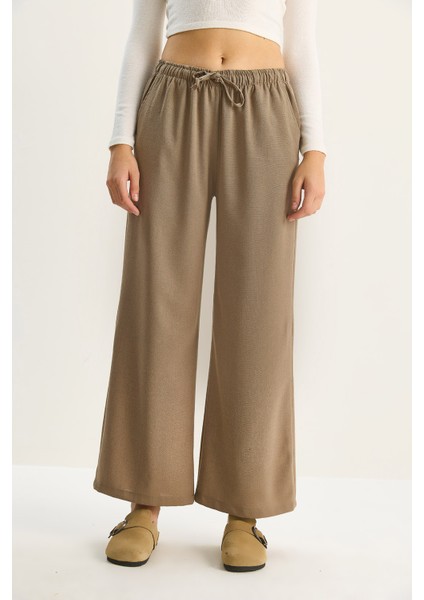 Kadın Yüksek Bel Beli Lastikli Bağlama Detaylı Cepli Kumaş Bol Pantolon fırsatları