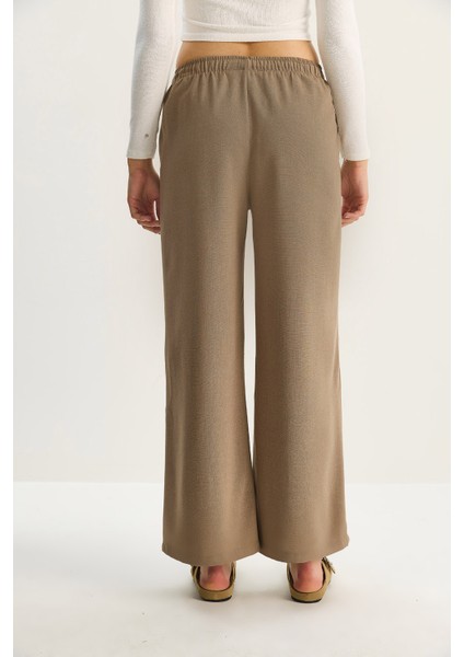Kadın Yüksek Bel Beli Lastikli Bağlama Detaylı Cepli Kumaş Bol Pantolon