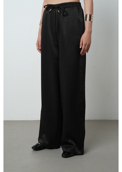 Kadın Düz Renk Parlak Kumaş Bol Paça Beli Lastikli Pantolon modelleri