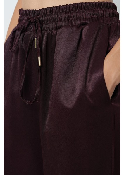 Kadın Düz Renk Bağcık Detaylı Bol Paça Beli Lastikli Pantolon fırsatları