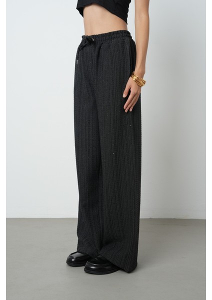 Kadın Simli Bol Paça Beli Lastikli Düz Renk Pantolon fiyatları