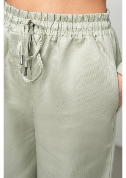 Kadın Bol Paça Beli Lastikli Bağcıklı Düz Renk Pantolon modelleri