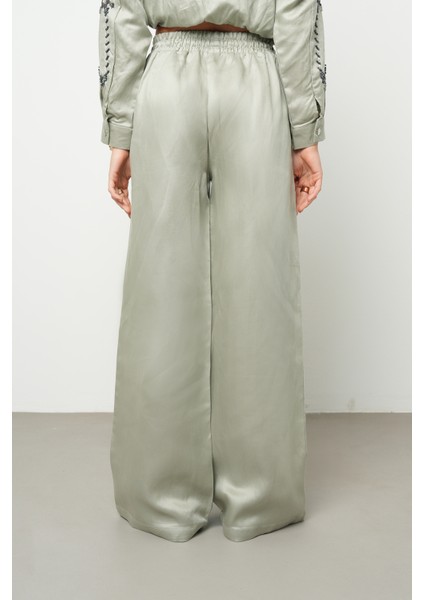 Kadın Bol Paça Beli Lastikli Bağcıklı Düz Renk Pantolon indirimleri
