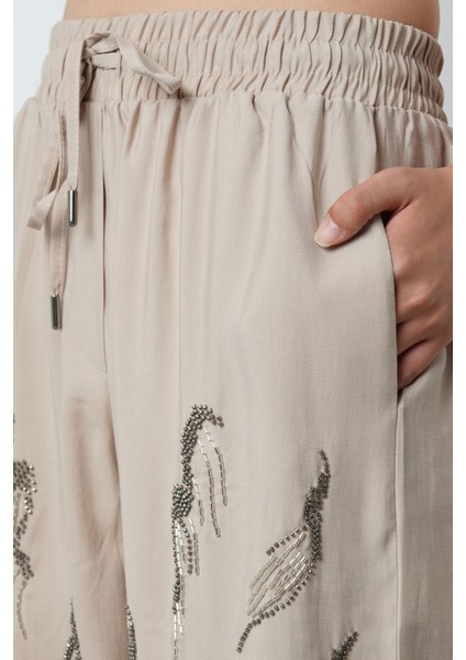 Kadın Önü Taş Işlemeli Düz Renk Beli Lastikli Bol Paça Pantolon fırsatları