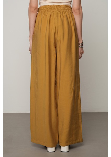 Kadın Şerit Gül ve Taş Detaylı Düz Renk Beli Lastikli Bol Paça Pantolon fırsatları