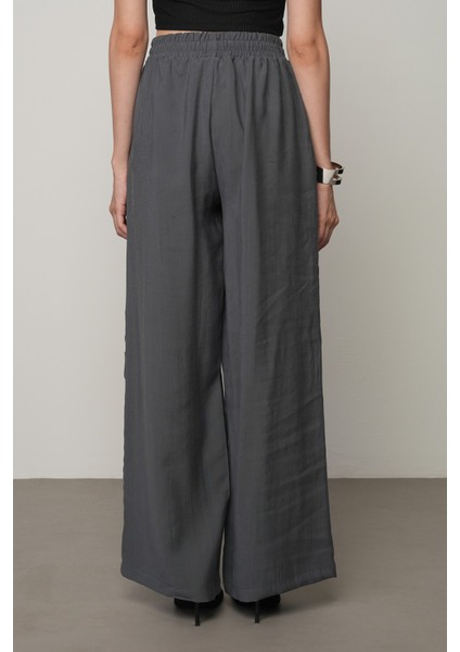 Kadın Şerit Gül ve Taş Detaylı Düz Renk Beli Lastikli Bol Paça Pantolon indirimleri