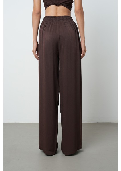 Kadın Düz Renk Altın Rengi Bağcık Detaylı Bol Paça Beli Lastikli Pantolon indirimleri