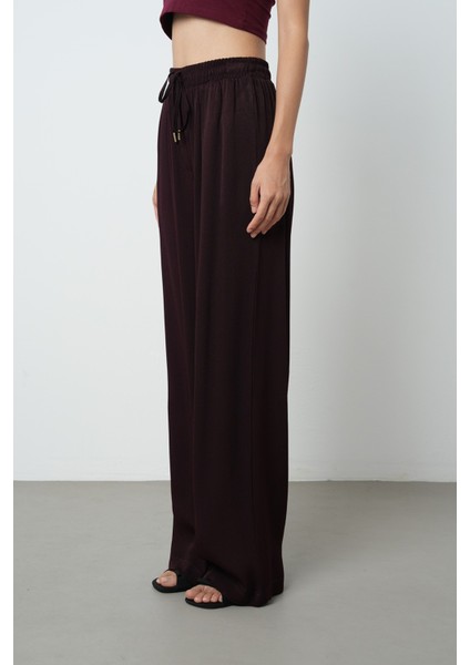 Kadın Düz Renk Altın Rengi Bağcık Detaylı Bol Paça Beli Lastikli Pantolon fiyatları