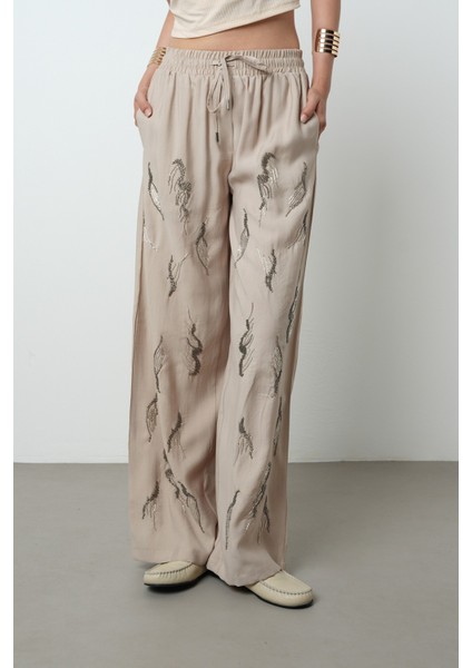 Kadın Önü Taş Işlemeli Düz Renk Beli Lastikli Bol Paça Pantolon modelleri