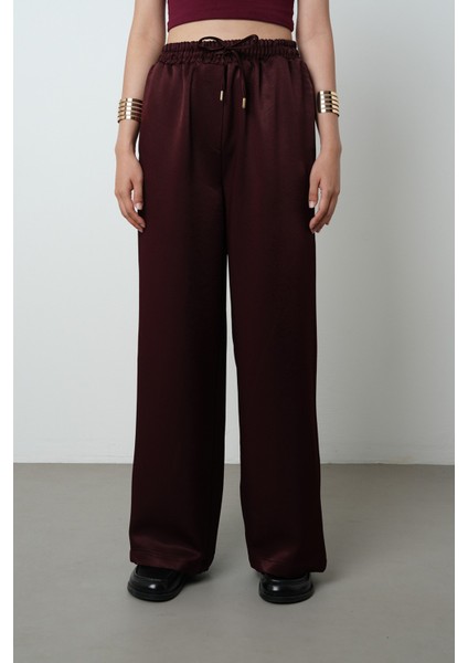 Kadın Düz Renk Parlak Kumaş Bol Paça Beli Lastikli Pantolon