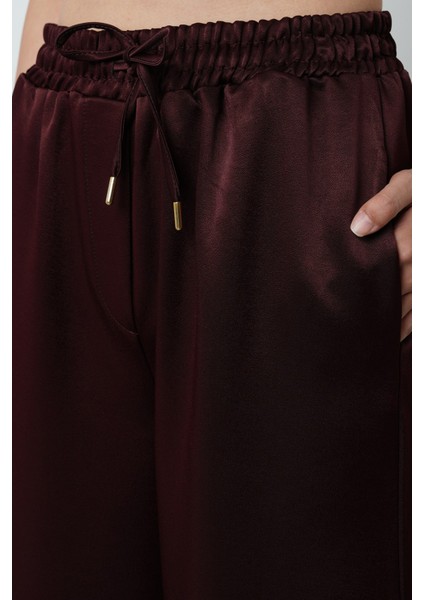 Kadın Düz Renk Parlak Kumaş Bol Paça Beli Lastikli Pantolon fırsatları