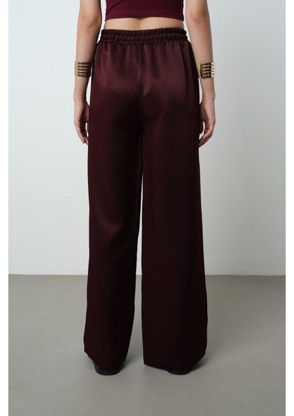 Kadın Düz Renk Parlak Kumaş Bol Paça Beli Lastikli Pantolon indirimleri
