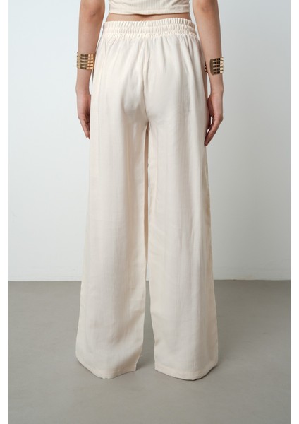 Kadın Yatay Şerit Taş Işlemeli Düz Renk Beli Lastikli Bol Paça Pantolon indirimleri