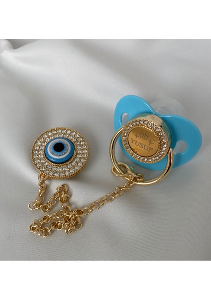 Altın Kaplama Isimli Zirkon Taşlı Silikon Emzik Seti (0-6 Ay) – Damaklı & Kişiye Özel Mavi Nazarlık fiyatları