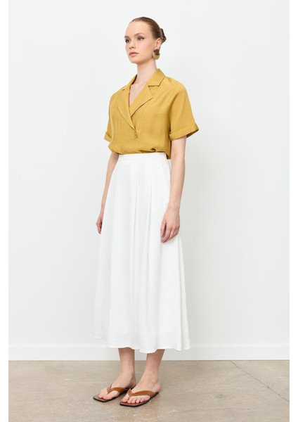 Pileli Uzun Kloş Etek-Kemık fiyatları