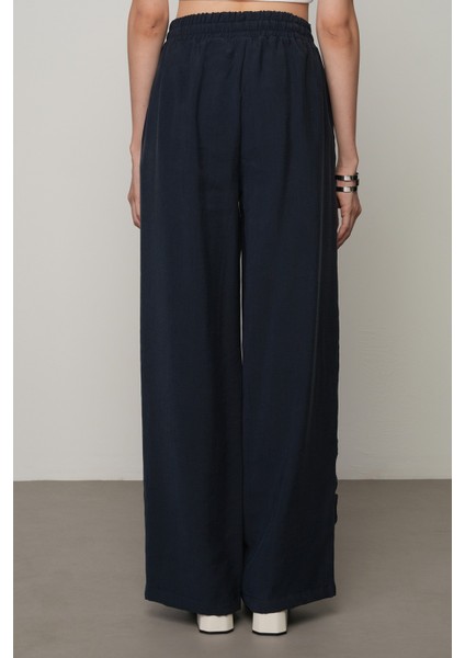 Kadın Şerit Gül ve Taş Detaylı Düz Renk Beli Lastikli Bol Paça Pantolon fırsatları