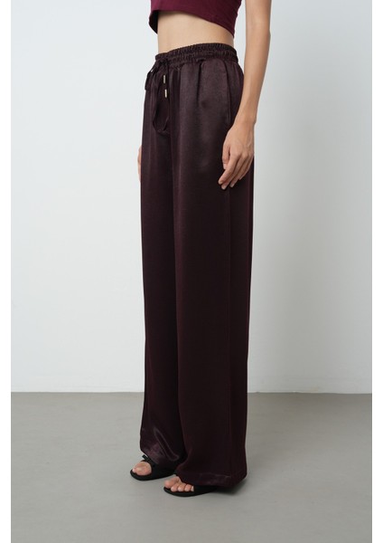 Kadın Düz Renk Bağcık Detaylı Bol Paça Beli Lastikli Pantolon fiyatları