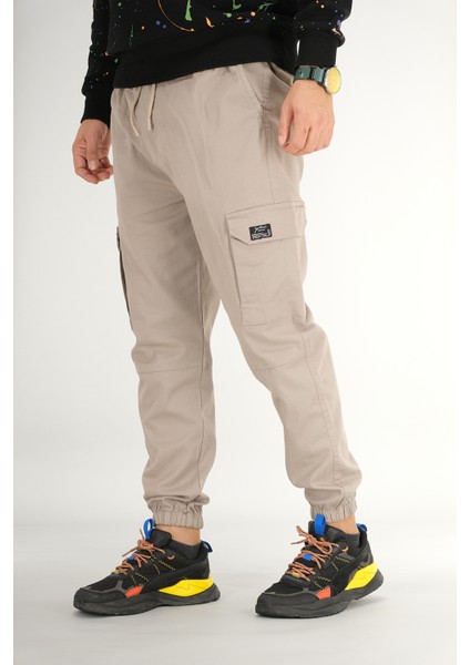 Erkek Taş Rengi Kargo Cepli Jogger Pantolon Rahat Kesim Pamuklu Lastikli Paça modelleri