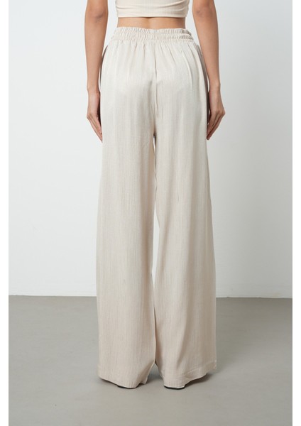 Kadın Bej Renk Ince Desenli Bol Paça Beli Lastikli Pantolon indirimleri