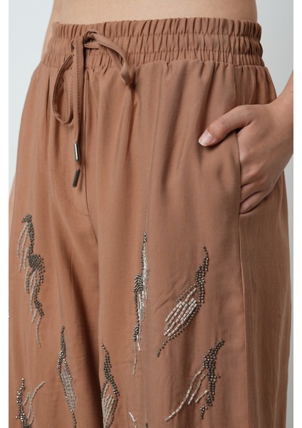 Kadın Önü Taş Işlemeli Düz Renk Beli Lastikli Bol Paça Pantolon fırsatları
