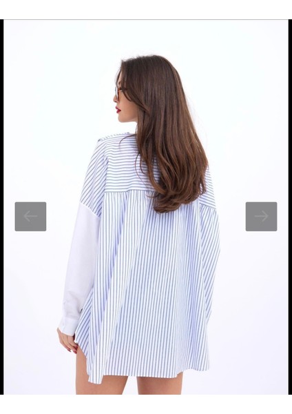 Gömlek Washington Çizgi sırt kısmında beyaz üstüne mavi çizgili ve önden biraz daha uzun omuzdan uzanan ayrı bir hava katan atkı detayı mevcut salaş bir model.. fırsatları