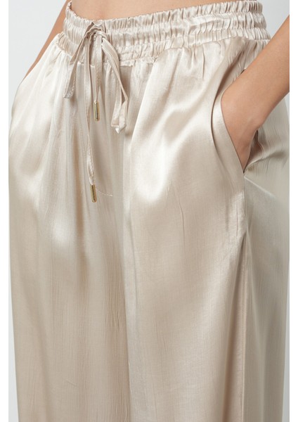 Kadın Açık Bej Düz %100 Viskoz Bol Paça Beli Lastikli Pantolon fırsatları