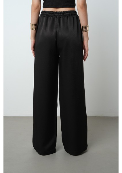 Kadın Düz Renk Parlak Kumaş Bol Paça Beli Lastikli Pantolon indirimleri