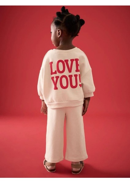 Kız Çocuk Pamuklu Bej Kalp Desenli Sweatshirt ve Geniş Paça Pantolon Takım - Yumuşak Dokulu Rahat Kalıp fiyatları
