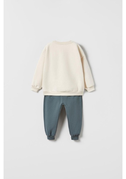 Erkek Çocuk Pamuklu Krem Köpek Desenli Sweatshirt ve Mavi Eşofman Altı Takım - Yumuşak Kumaş Konforu fiyatları