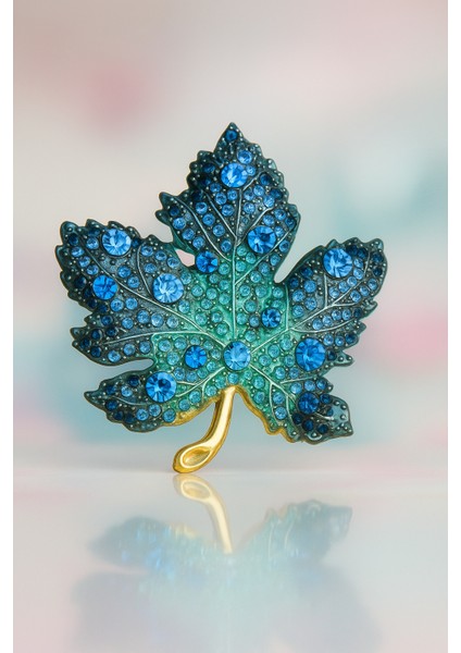 Göksunun Izi Mavi Taşlı Altın Tonlu Yaprak Formlu Metal Broş Aksesuar fiyatları