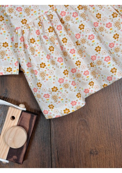 Pamuklu Çiçek Desenli Uzun Kollu Kız Bebek Elbisesi indirimleri