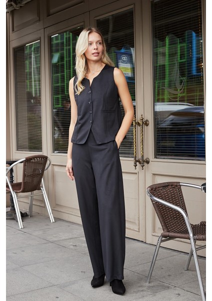 Kadın Süet Dokulu Kumaş Yüksek Bel Yan Cepli Beli Lastikli Bol Paça Palazzo Pantolon-Siyah fiyatları