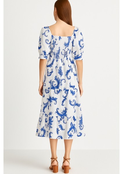 Önü ve Arkası U Kare Yaka Desenli Volanlı Lastikli Kısa Kol Göğsü Gipeli Elbise