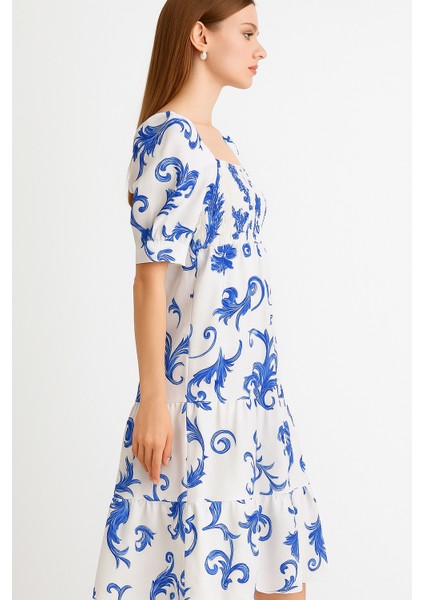 Önü ve Arkası U Kare Yaka Desenli Volanlı Lastikli Kısa Kol Göğsü Gipeli Elbise fırsatları