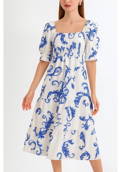 Önü ve Arkası U Kare Yaka Desenli Volanlı Lastikli Kısa Kol Göğsü Gipeli Elbise