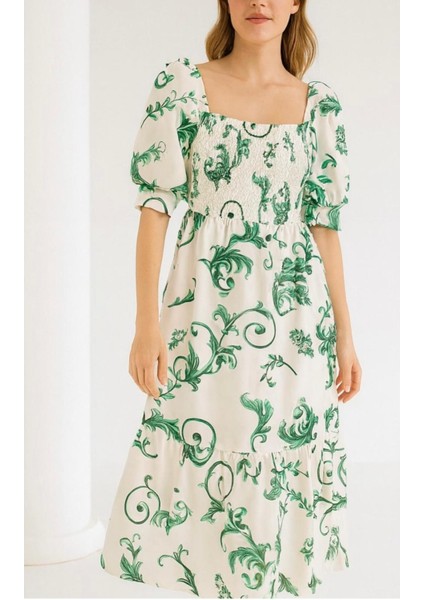 Önü ve Arkası U Kare Yaka Desenli Volanlı Lastikli Kısa Kol Göğsü Gipeli Elbise