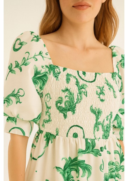 Önü ve Arkası U Kare Yaka Desenli Volanlı Lastikli Kısa Kol Göğsü Gipeli Elbise fiyatları