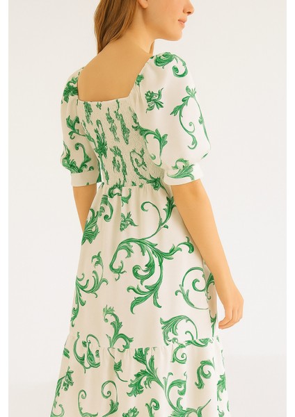 Önü ve Arkası U Kare Yaka Desenli Volanlı Lastikli Kısa Kol Göğsü Gipeli Elbise modelleri