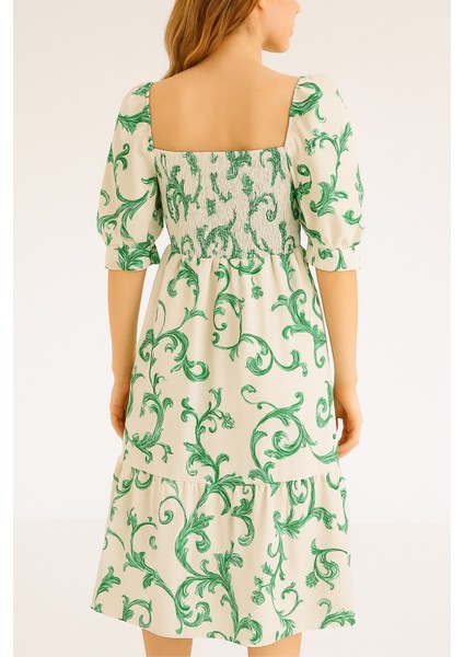 Önü ve Arkası U Kare Yaka Desenli Volanlı Lastikli Kısa Kol Göğsü Gipeli Elbise indirimleri