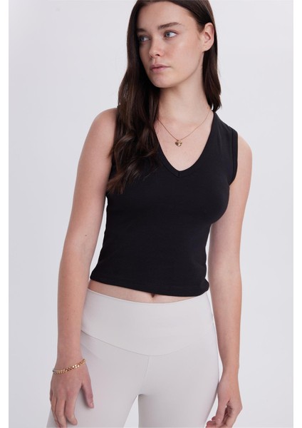 Kadın Slim Fit Dar Kesim V Yaka Sıfır Kol Pamuklu Ribanalı Siyah Bluz indirimleri