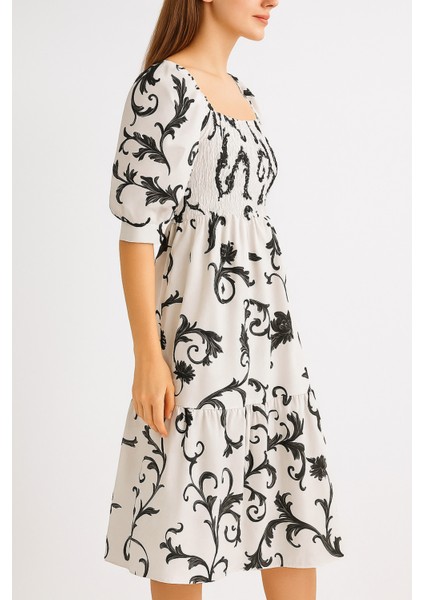 Önü ve Arkası U Kare Yaka Desenli Volanlı Lastikli Kısa Kol Göğsü Gipeli Elbise modelleri