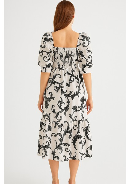 Önü ve Arkası U Kare Yaka Desenli Volanlı Lastikli Kısa Kol Göğsü Gipeli Elbise fırsatları