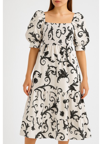 Önü ve Arkası U Kare Yaka Desenli Volanlı Lastikli Kısa Kol Göğsü Gipeli Elbise indirimleri