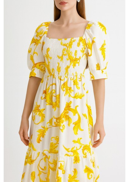 Önü ve Arkası U Kare Yaka Desenli Volanlı Lastikli Kısa Kol Göğsü Gipeli Elbise fiyatları