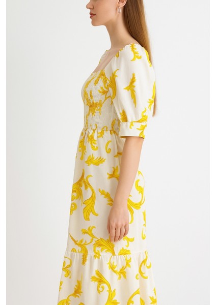 Önü ve Arkası U Kare Yaka Desenli Volanlı Lastikli Kısa Kol Göğsü Gipeli Elbise modelleri