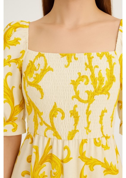 Önü ve Arkası U Kare Yaka Desenli Volanlı Lastikli Kısa Kol Göğsü Gipeli Elbise fırsatları