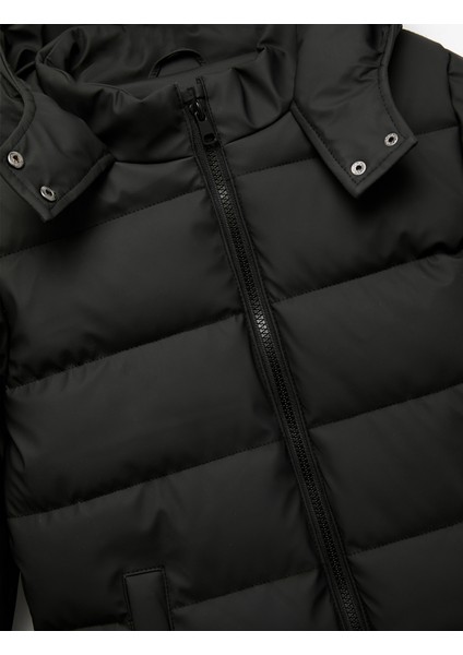 Uzun Kollu Fermuarlı Cepli Içi Suni Kürklü Kapşonlu Uzun Şişme Mont modelleri