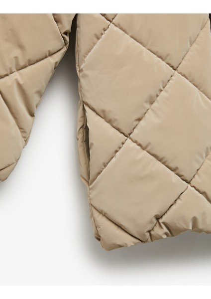 Uzun Kollu Fermuarlı Kapitone Kapşonlu Şişme Mont modelleri